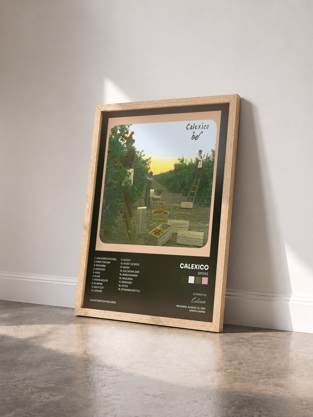 #bois Tableau de l'album Spoke de Calexico vu de trois quarts, cadre en bois brut