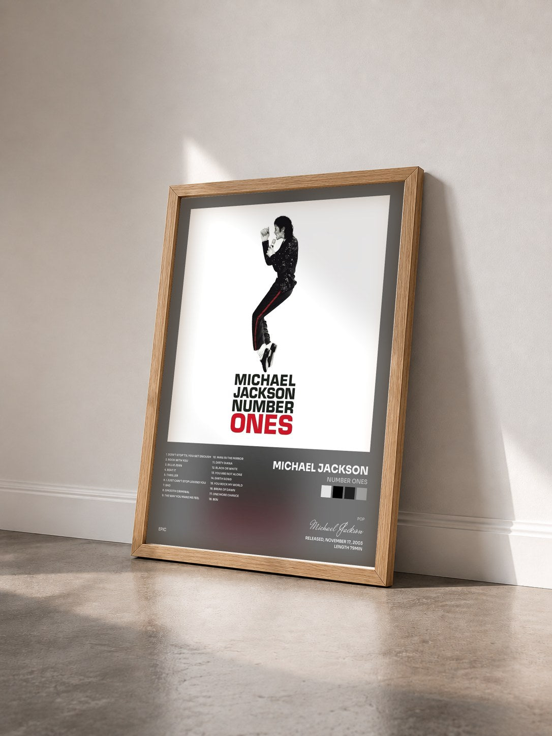 #bois Tableau de l'album Number Ones de Michael Jackson vu de trois quarts, cadre en bois brut