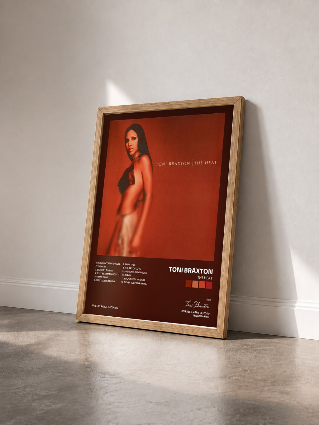 #bois Tableau de l'album The Heat de Toni Braxton vu de trois quarts, cadre en bois brut