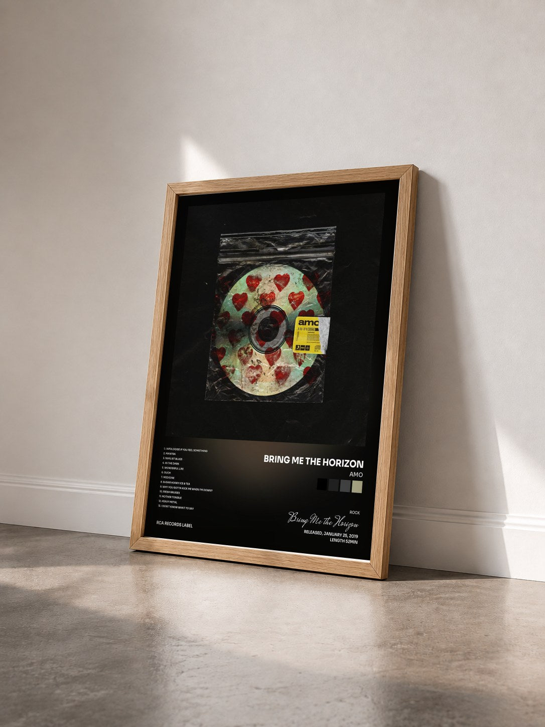 #bois Tableau de l'album amo de Bring Me the Horizon vu de trois quarts, cadre en bois brut