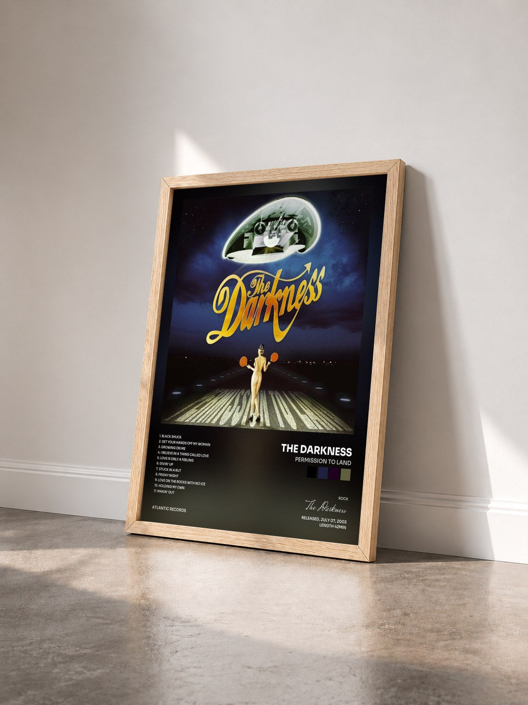 #bois Tableau de l'album Permission to Land de The Darkness vu de trois quarts, cadre en bois brut