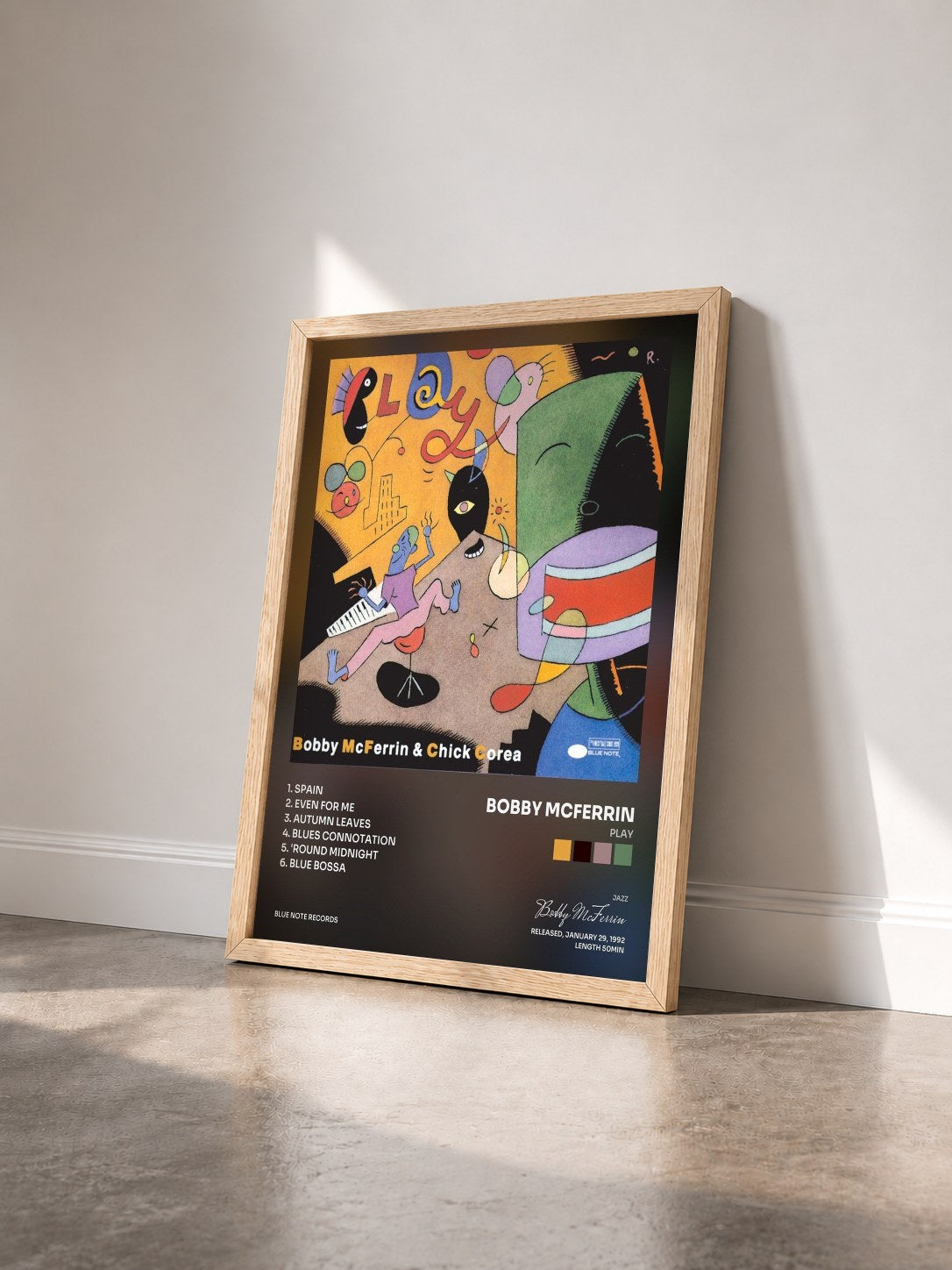 #bois Tableau de l'album Play de Bobby McFerrin vu de trois quarts, cadre en bois brut