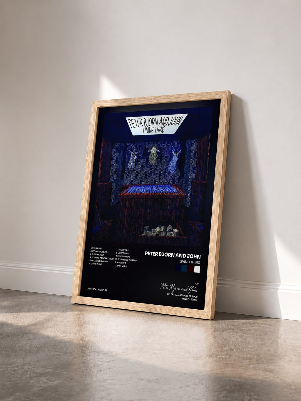 #bois Tableau de l'album Living Thing de Peter Bjorn and John vu de trois quarts, cadre en bois brut