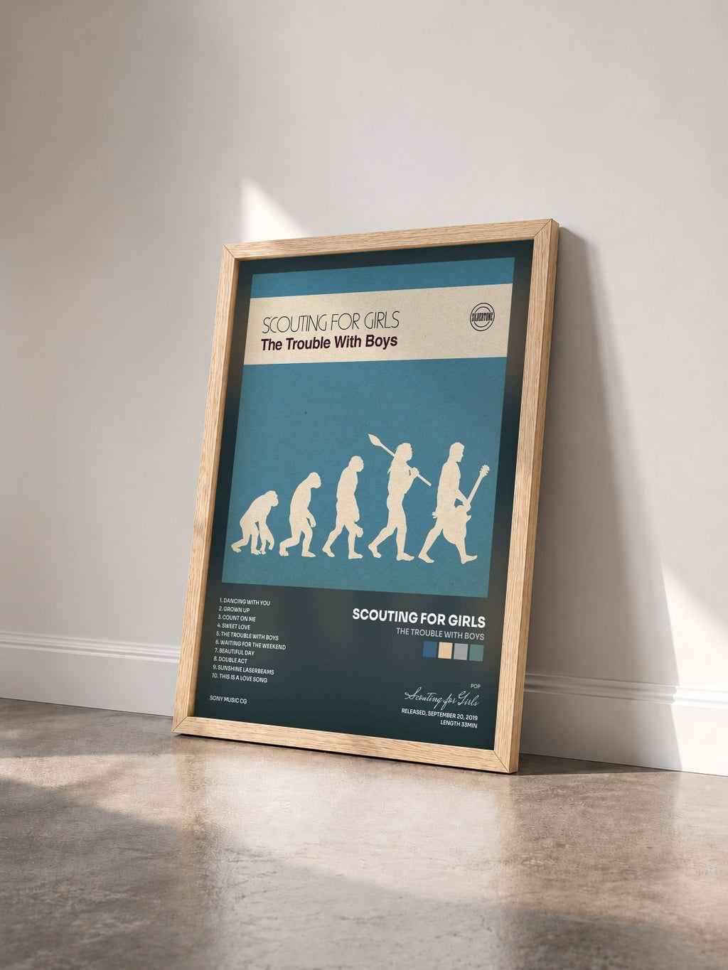 #bois Tableau de l'album The Trouble with Boys de Scouting for Girls vu de trois quarts, cadre en bois brut