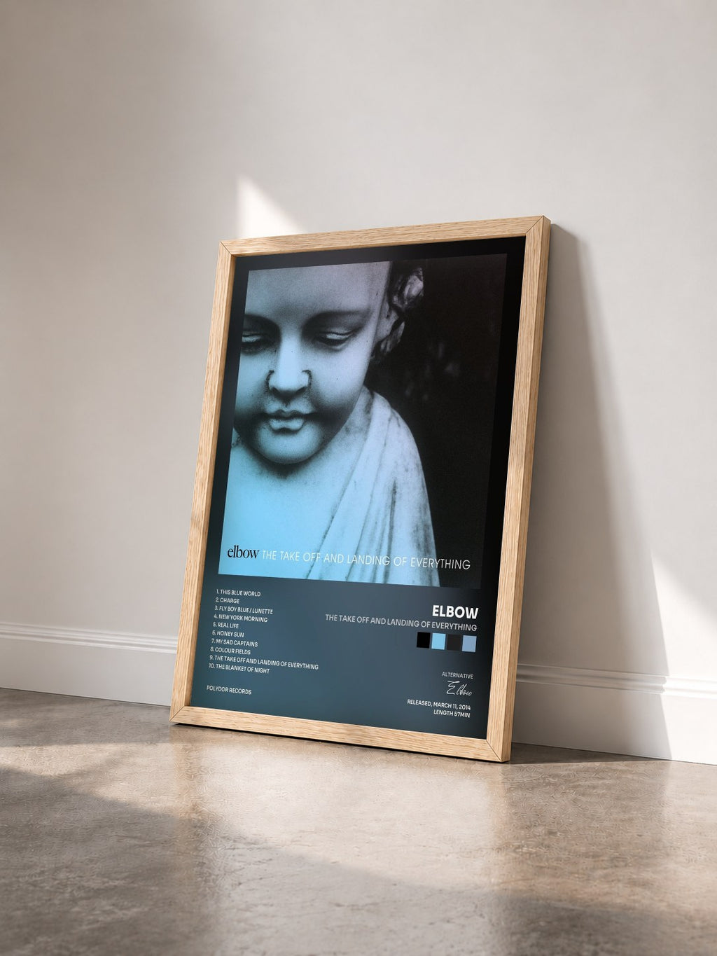 #bois Tableau de l'album The Take Off And Landing Of Everything de Elbow vu de trois quarts, cadre en bois brut