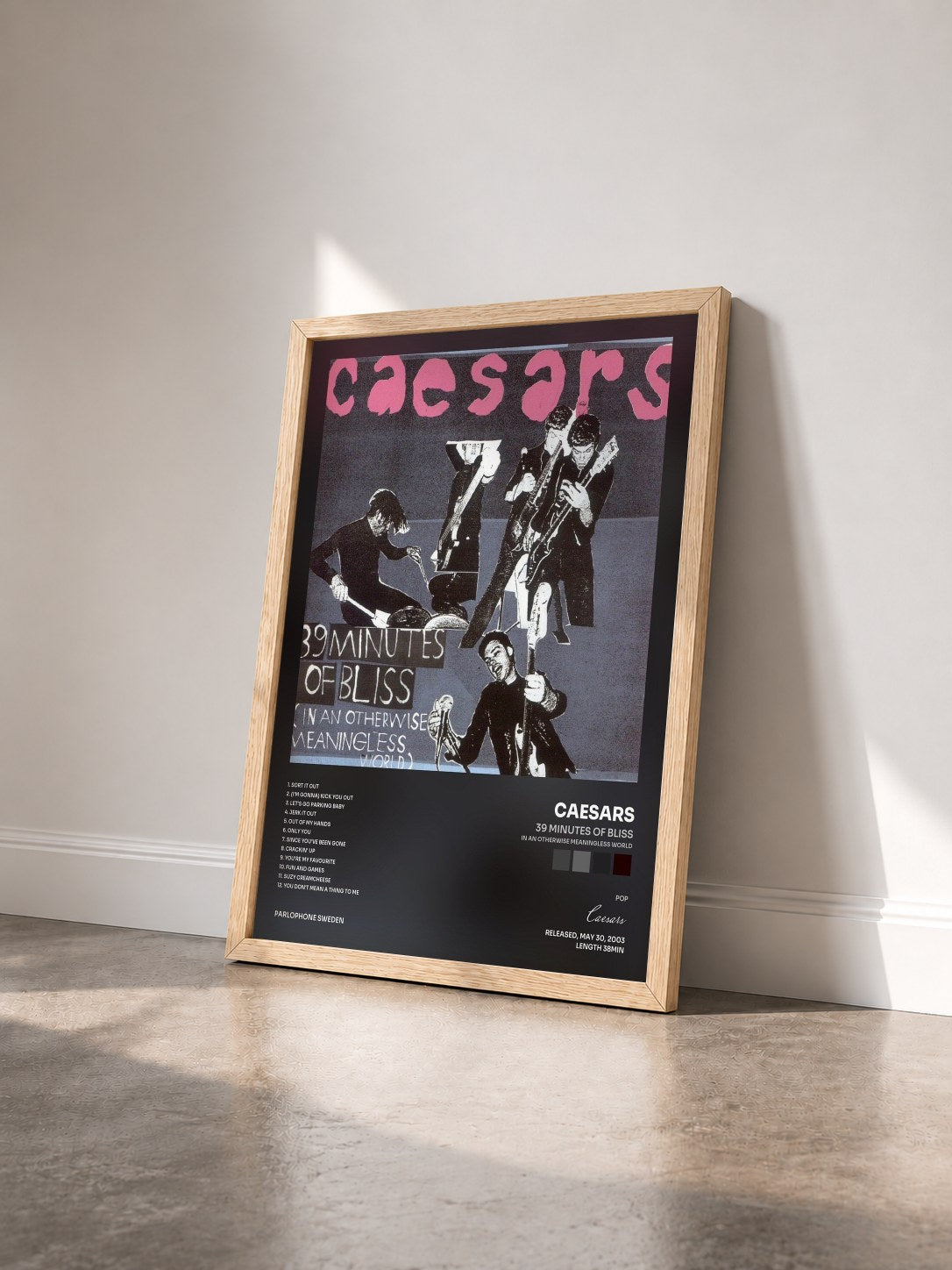 #bois Tableau de l'album 39 Minutes Of Bliss (In An Otherwise Meaningless World) de Caesars vu de trois quarts, cadre en bois brut