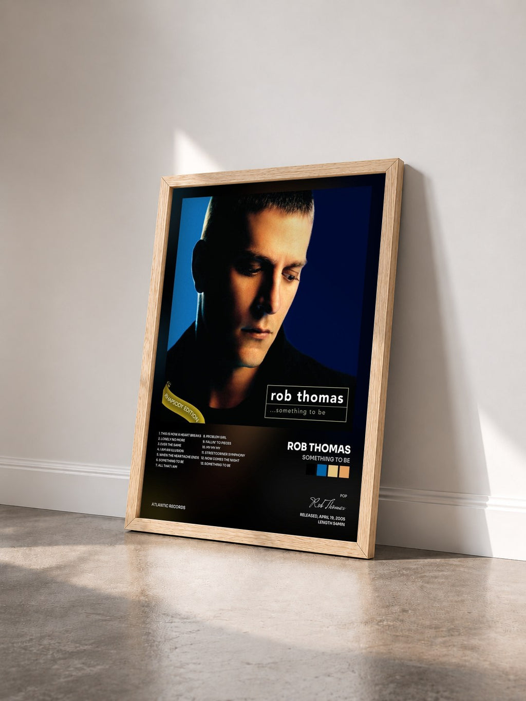 #bois Tableau de l'album Something to Be de Rob Thomas vu de trois quarts, cadre en bois brut