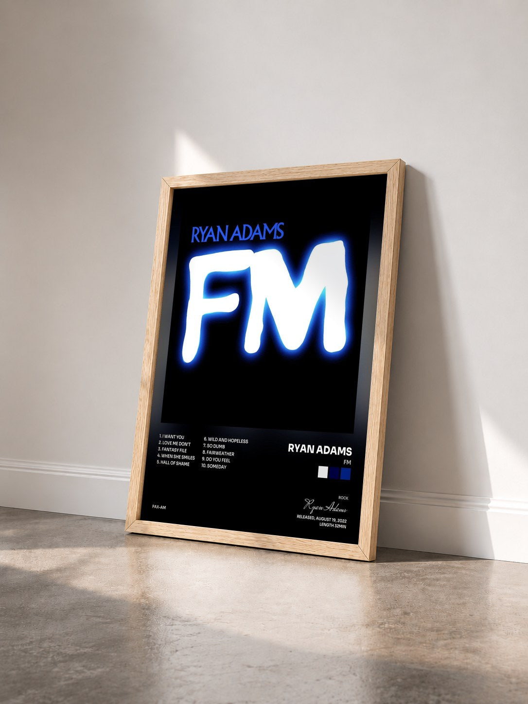 #bois Tableau de l'album FM de Ryan Adams vu de trois quarts, cadre en bois brut