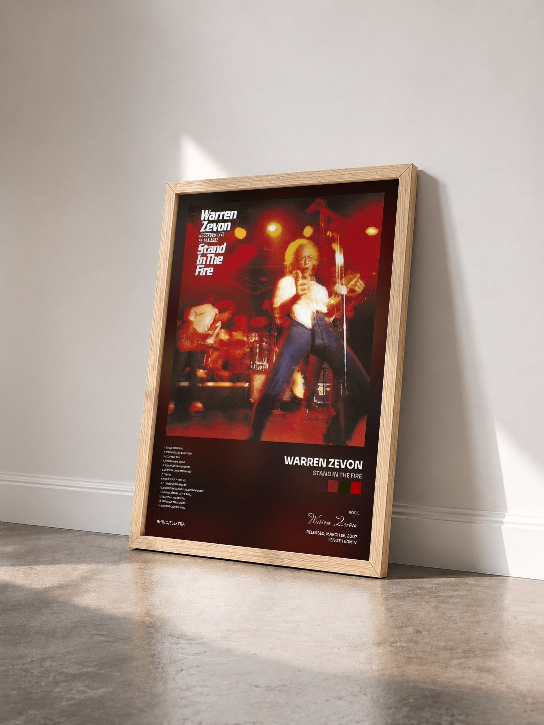 #bois Tableau de l'album Stand in the Fire de Warren Zevon vu de trois quarts, cadre en bois brut