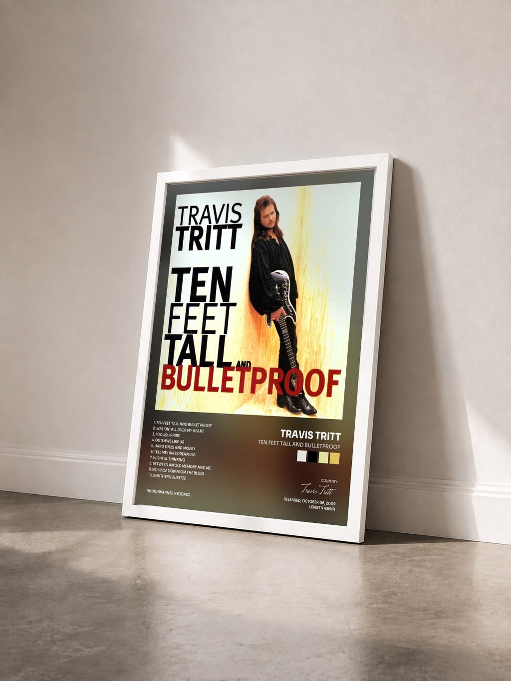 #blanc Tableau de l'album Ten Feet Tall and Bulletproof de Travis Tritt vu de trois quarts, cadre blanc