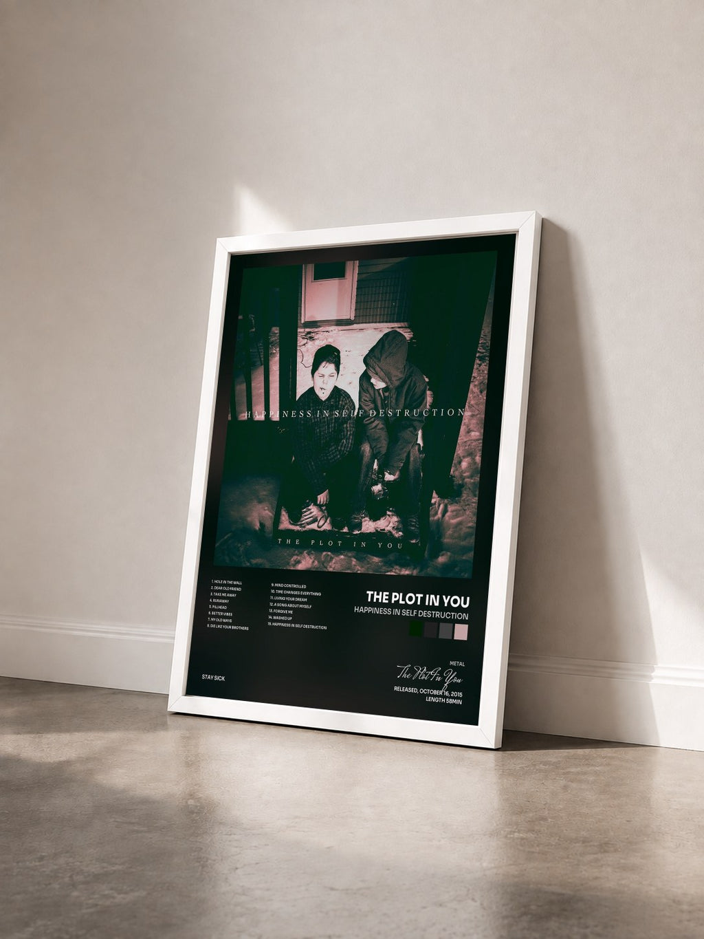 #blanc Tableau de l'album Happiness in Self Destruction de The Plot In You vu de trois quarts, cadre blanc