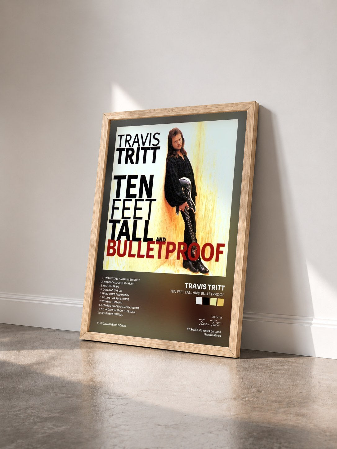 #bois Tableau de l'album Ten Feet Tall and Bulletproof de Travis Tritt vu de trois quarts, cadre en bois brut
