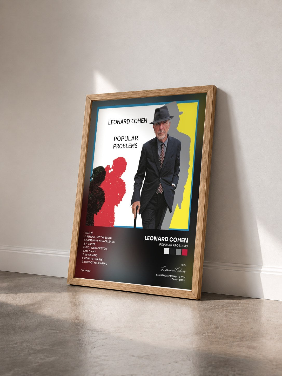 #bois Tableau de l'album Popular Problems de Leonard Cohen vu de trois quarts, cadre en bois brut