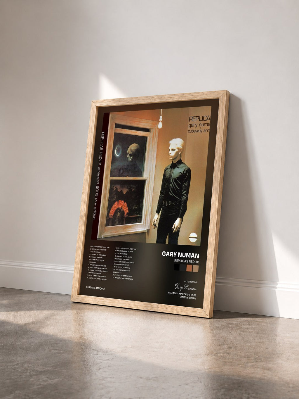 #bois Tableau de l'album Replicas Redux de Gary Numan vu de trois quarts, cadre en bois brut