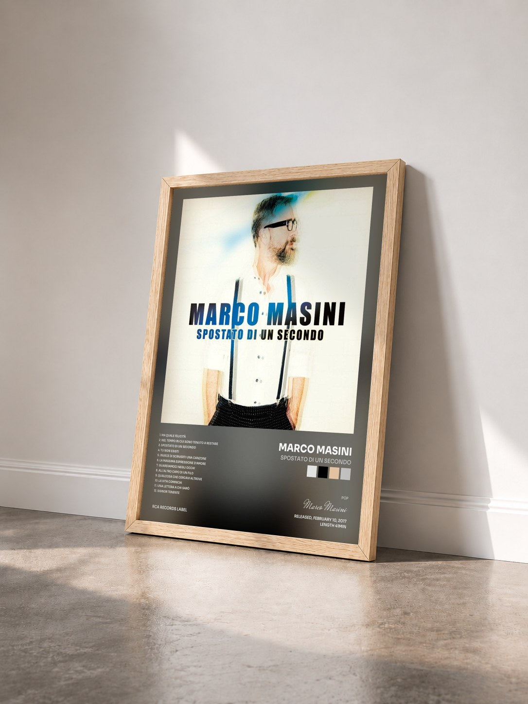 #bois Tableau de l'album Spostato di un secondo de Marco Masini vu de trois quarts, cadre en bois brut