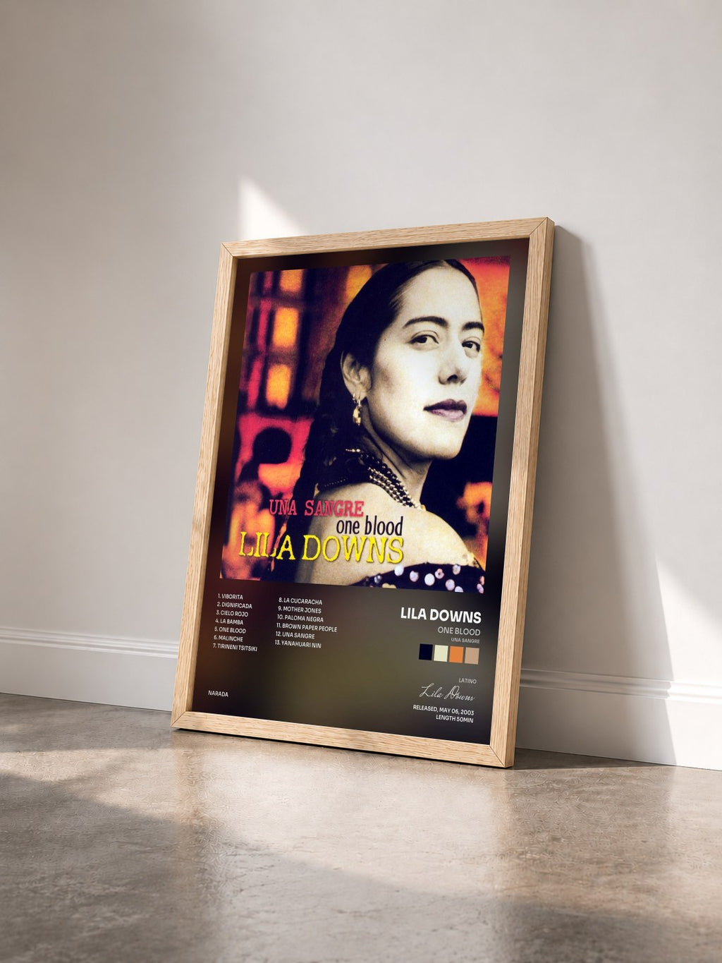 #bois Tableau de l'album One Blood (Una Sangre) de Lila Downs vu de trois quarts, cadre en bois brut