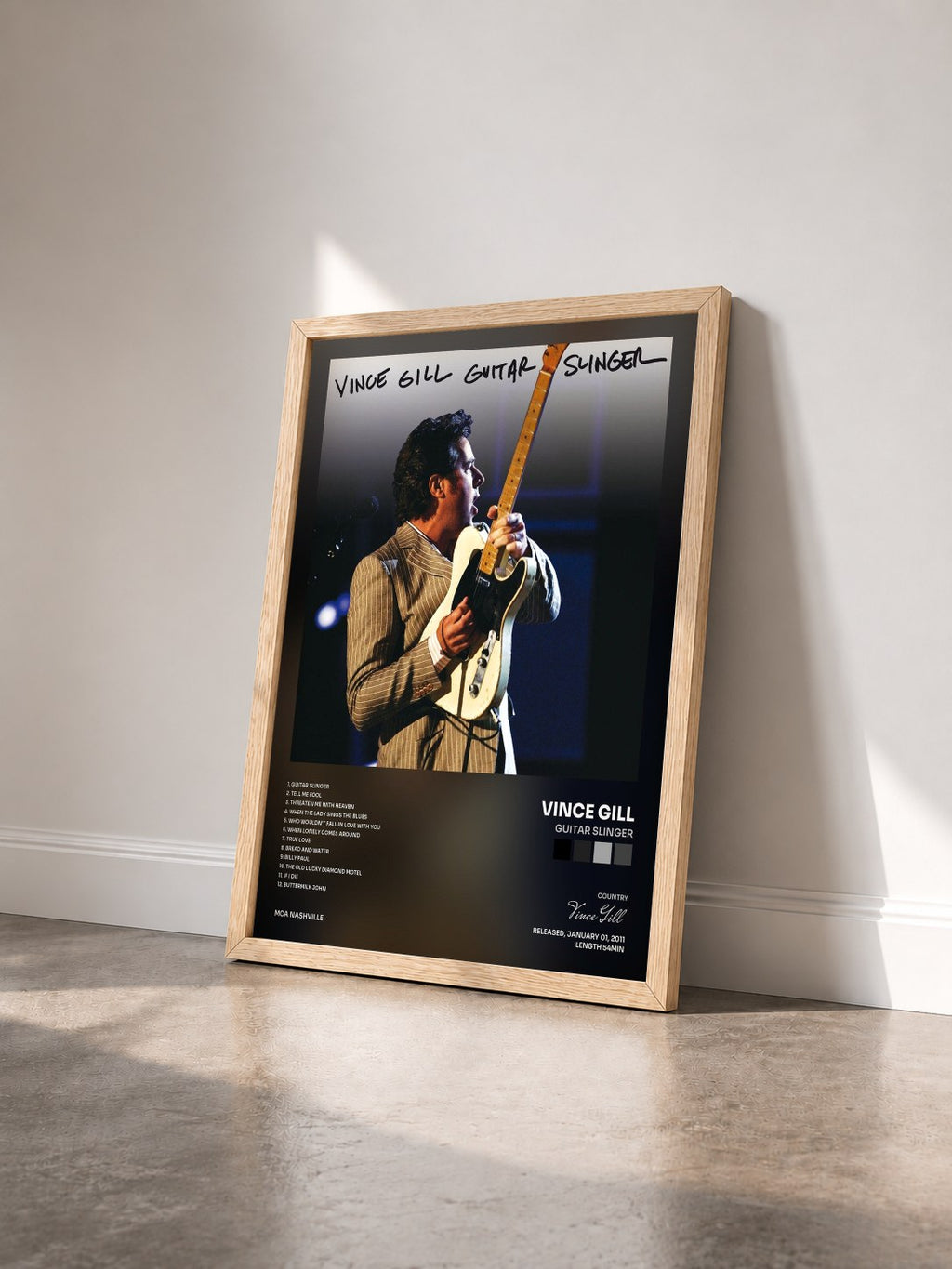 #bois Tableau de l'album Guitar Slinger de Vince Gill vu de trois quarts, cadre en bois brut