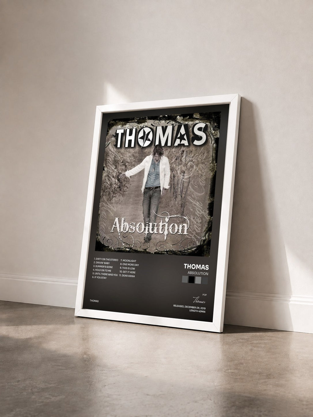 #blanc Tableau de l'album Absolution de Thomas vu de trois quarts, cadre blanc