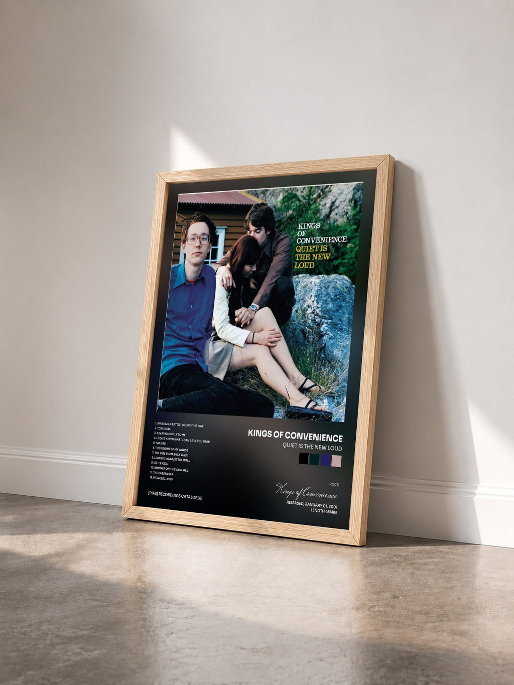 #bois Tableau de l'album Quiet Is The New Loud de Kings of Convenience vu de trois quarts, cadre en bois brut