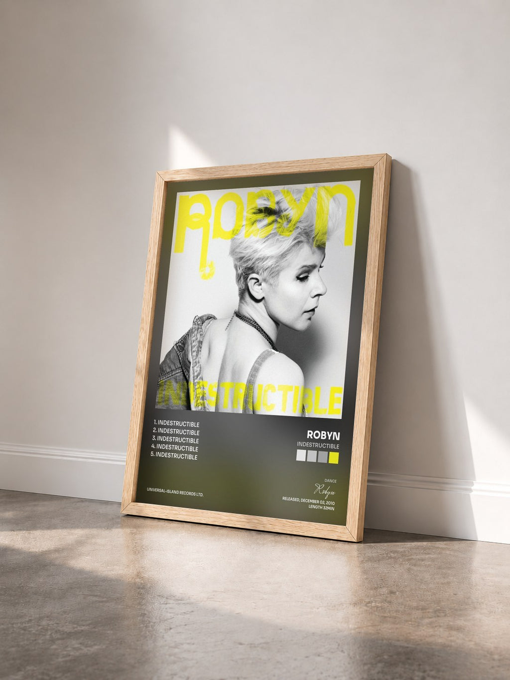 #bois Tableau de l'album Indestructible de Robyn vu de trois quarts, cadre en bois brut
