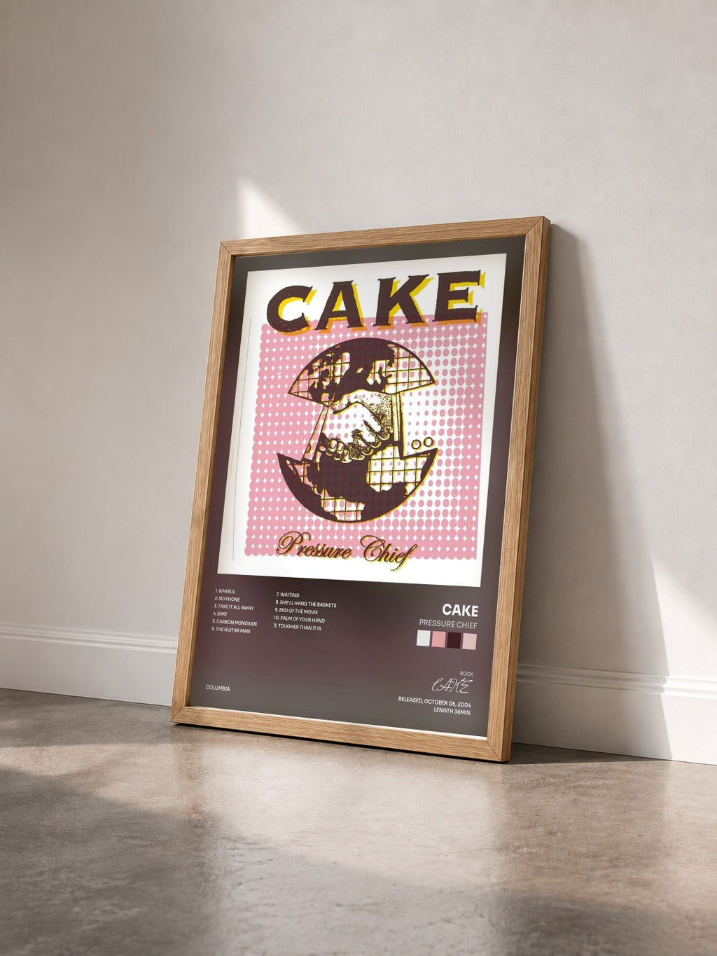 #bois Tableau de l'album Pressure Chief de CAKE vu de trois quarts, cadre en bois brut