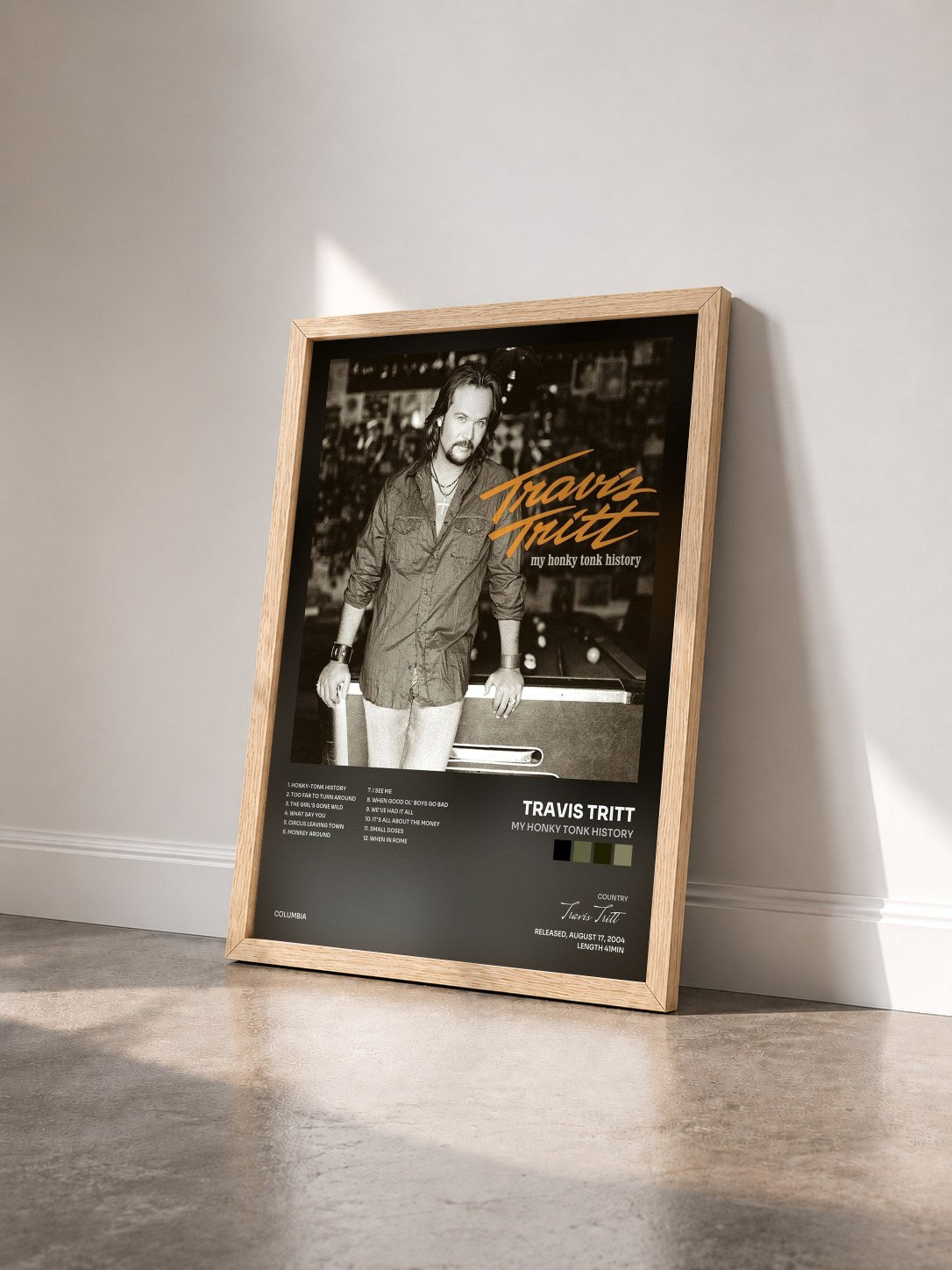 #bois Tableau de l'album My Honky Tonk History de Travis Tritt vu de trois quarts, cadre en bois brut