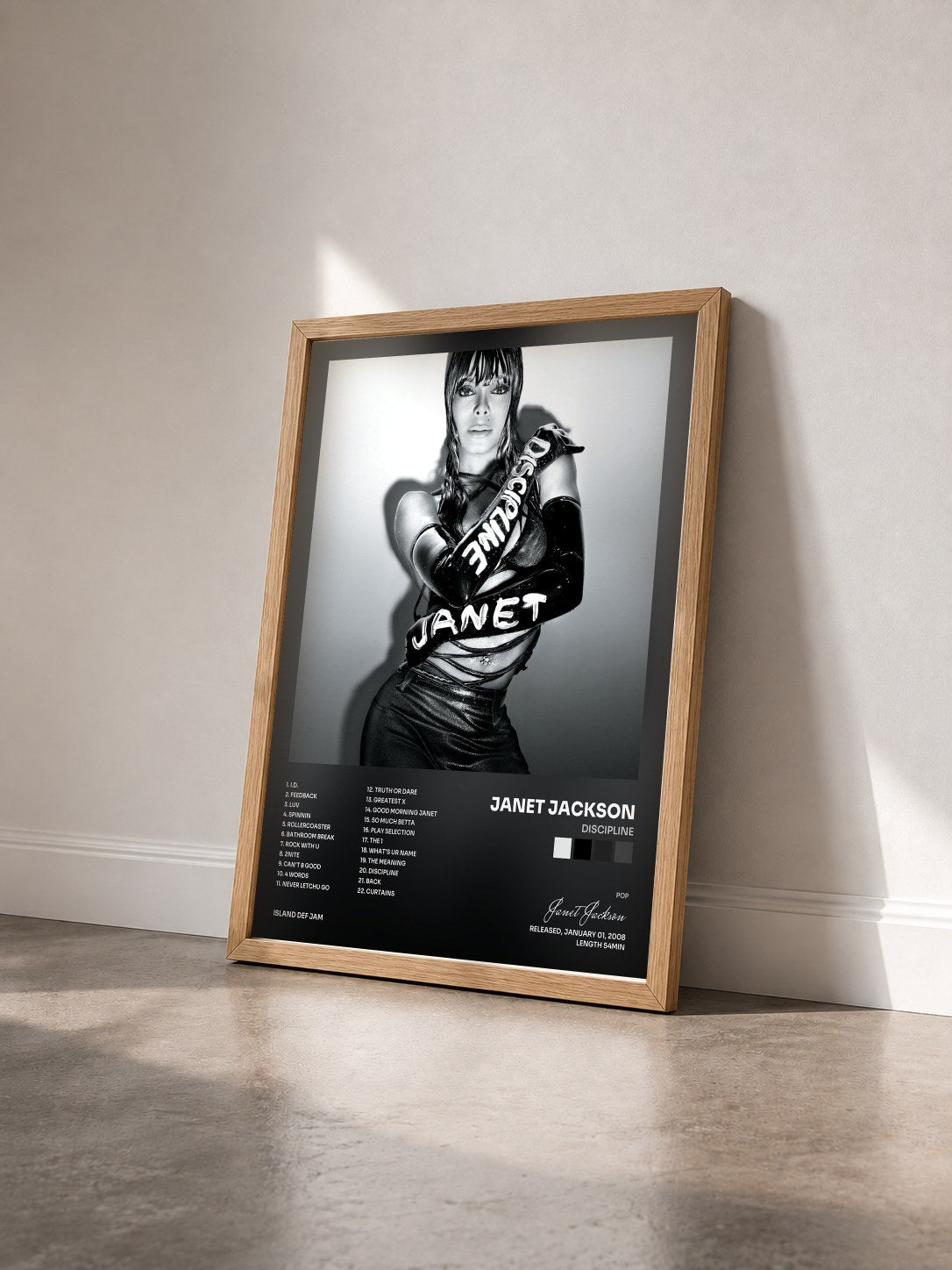 #bois Tableau de l'album Discipline de Janet Jackson vu de trois quarts, cadre en bois brut