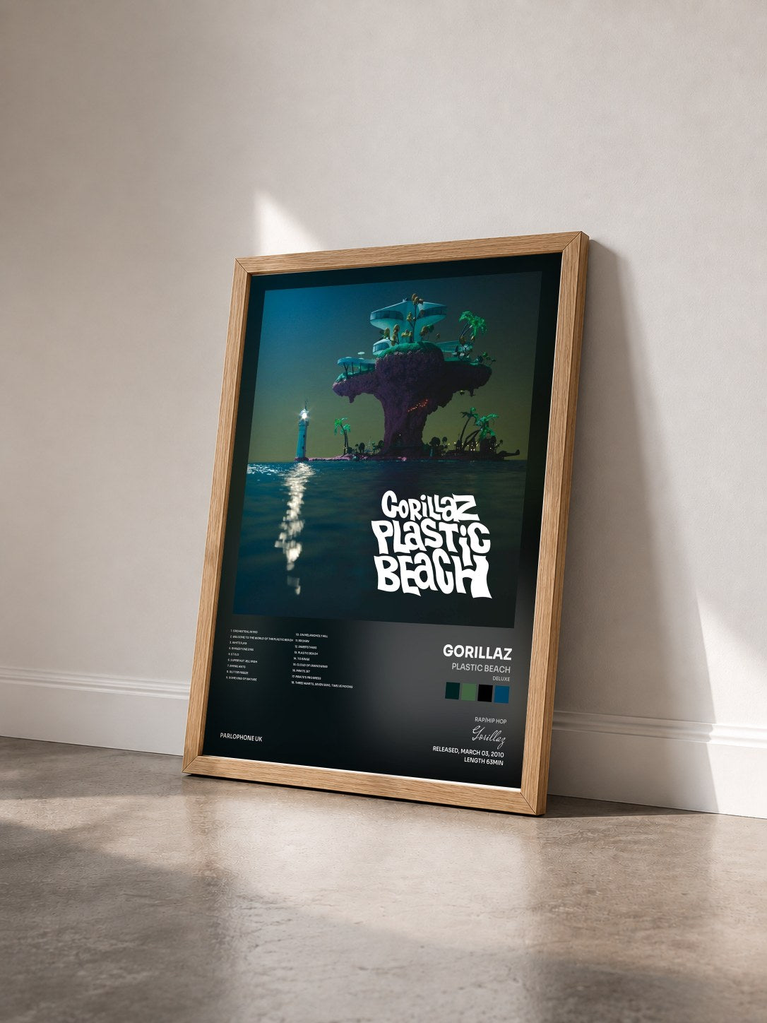 #bois Tableau de l'album Plastic Beach (Deluxe) de Gorillaz vu de trois quarts, cadre en bois brut