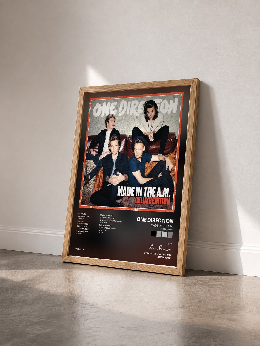 #bois Tableau de l'album Made In The A.M. (Deluxe Edition) de One Direction vu de trois quarts, cadre en bois brut