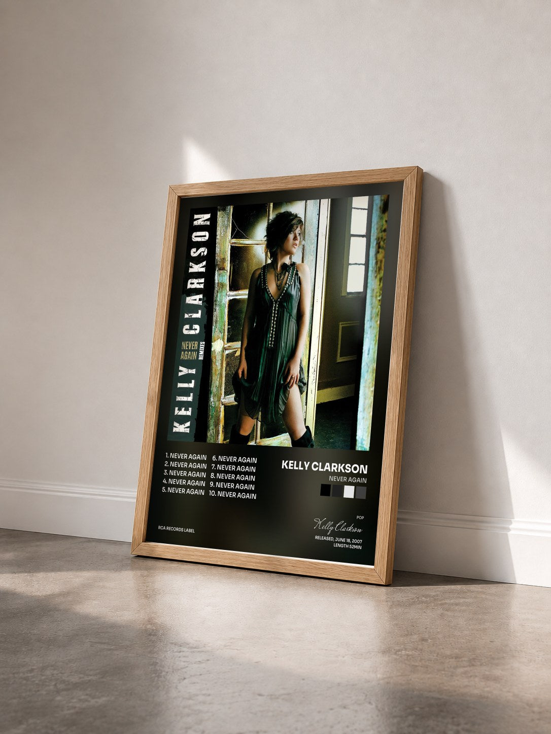 #bois Tableau de l'album Never Again de Kelly Clarkson vu de trois quarts, cadre en bois brut