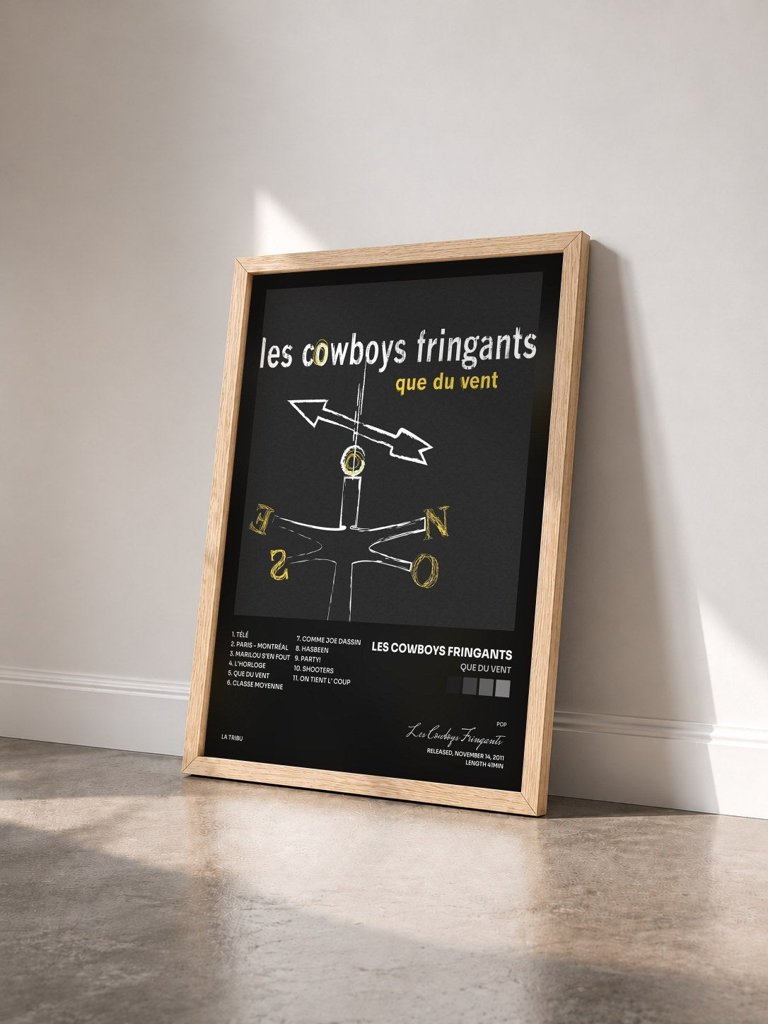 #bois Tableau de l'album Que du vent de Les Cowboys Fringants vu de trois quarts, cadre en bois brut