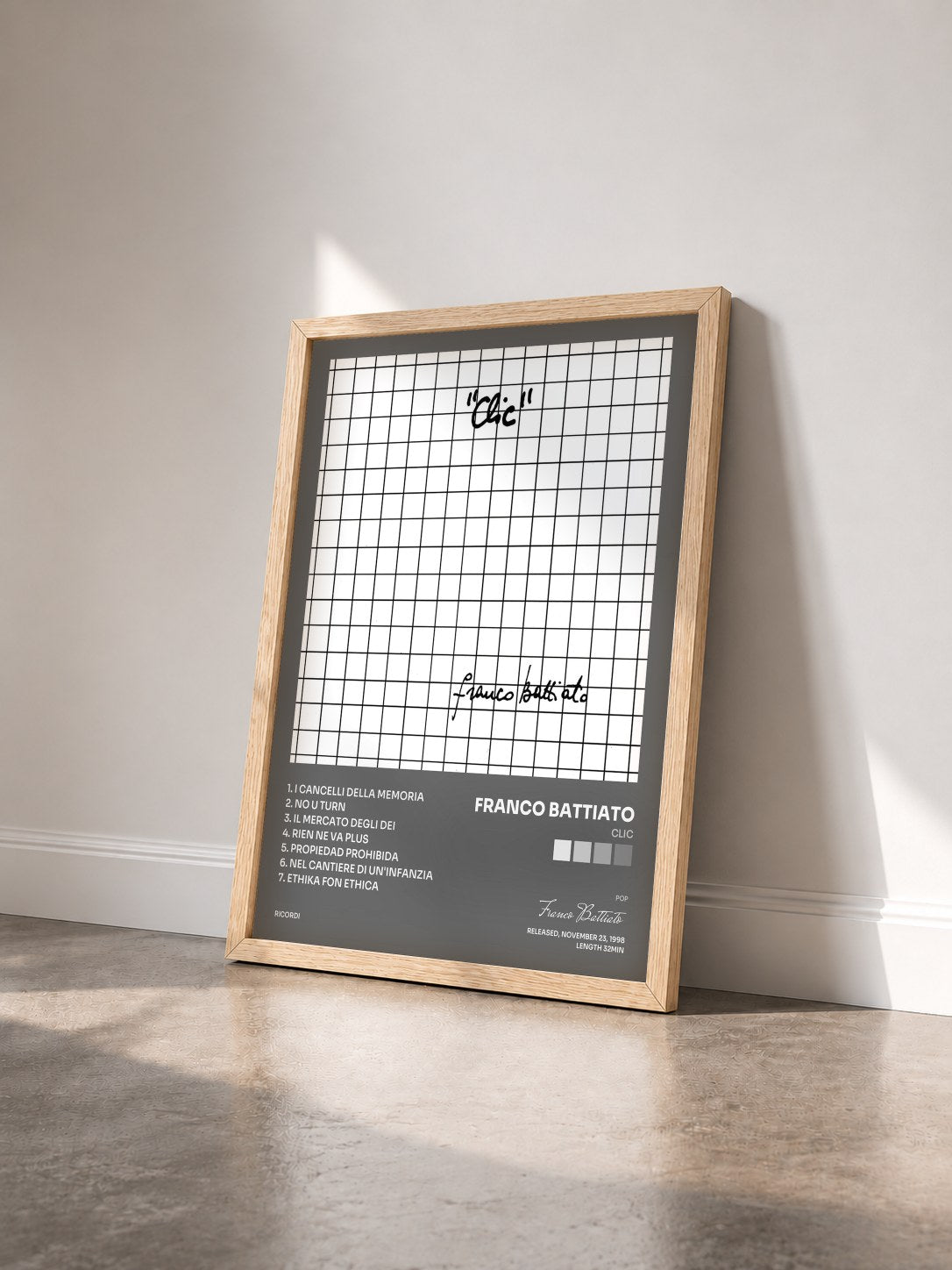 #bois Tableau de l'album Clic de Franco Battiato vu de trois quarts, cadre en bois brut