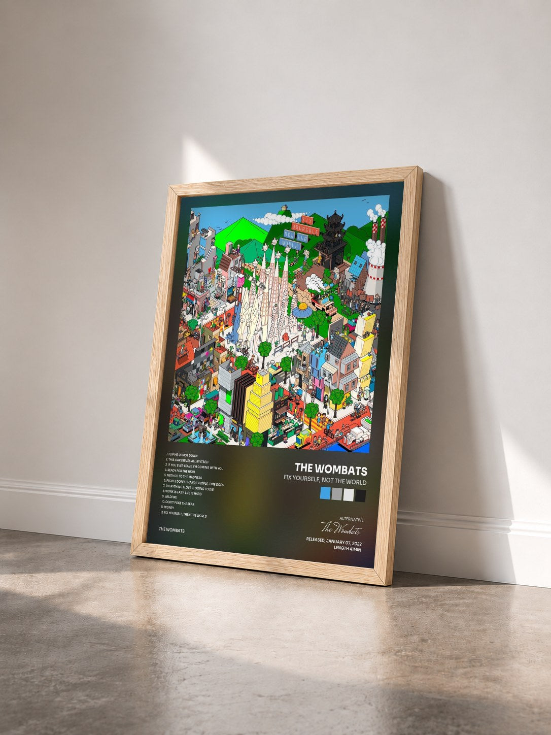 #bois Tableau de l'album Fix Yourself, Not the World de The Wombats vu de trois quarts, cadre en bois brut