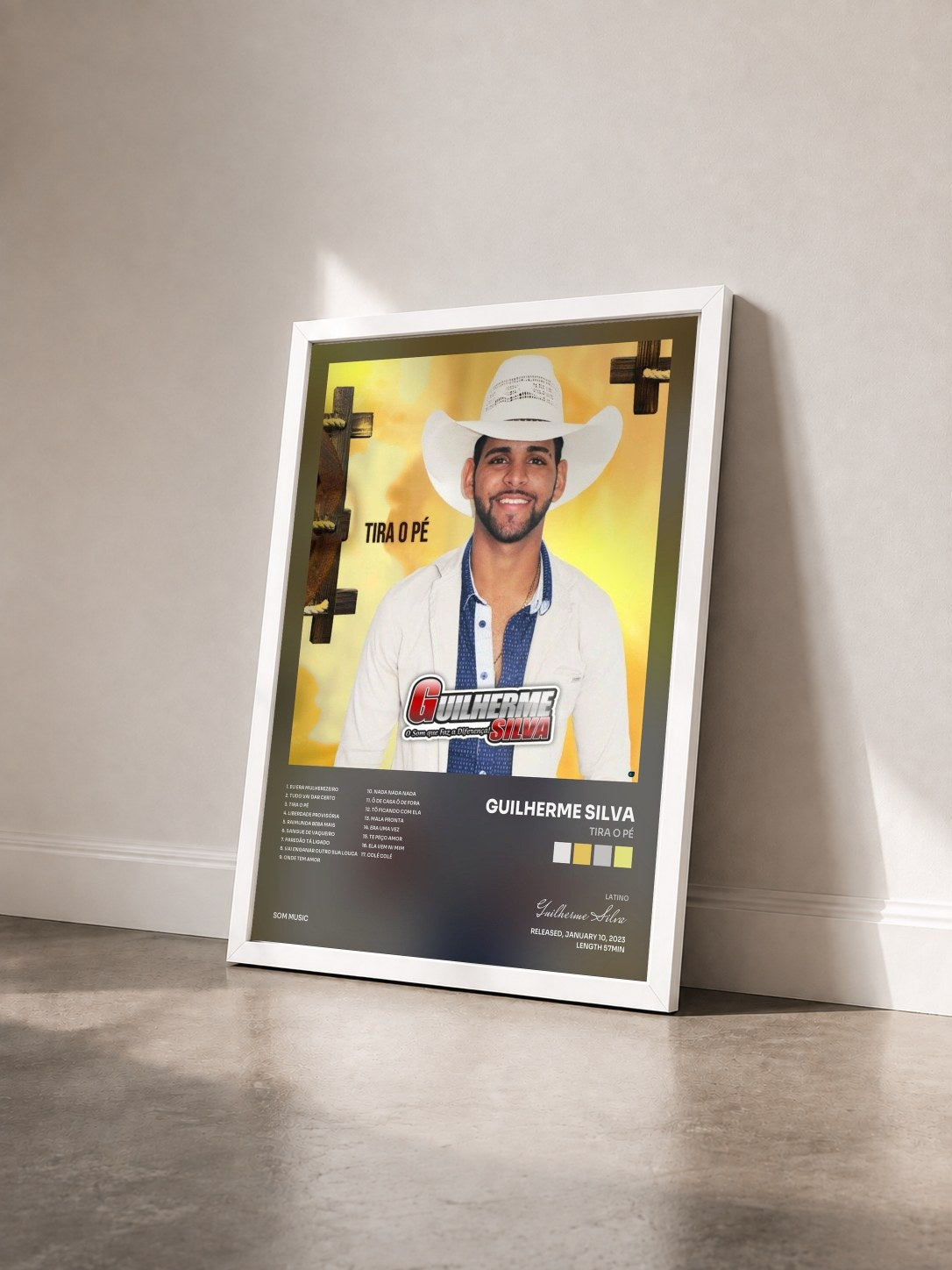 #blanc Tableau de l'album Tira o Pé de Guilherme Silva vu de trois quarts, cadre blanc