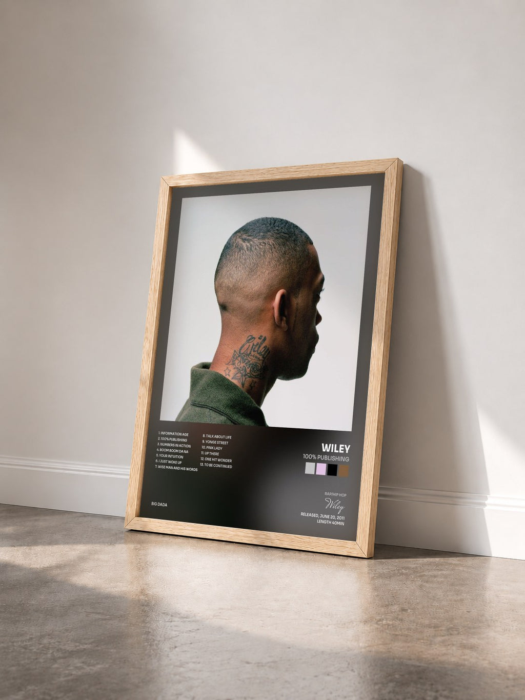 #bois Tableau de l'album 100% Publishing de Wiley vu de trois quarts, cadre en bois brut