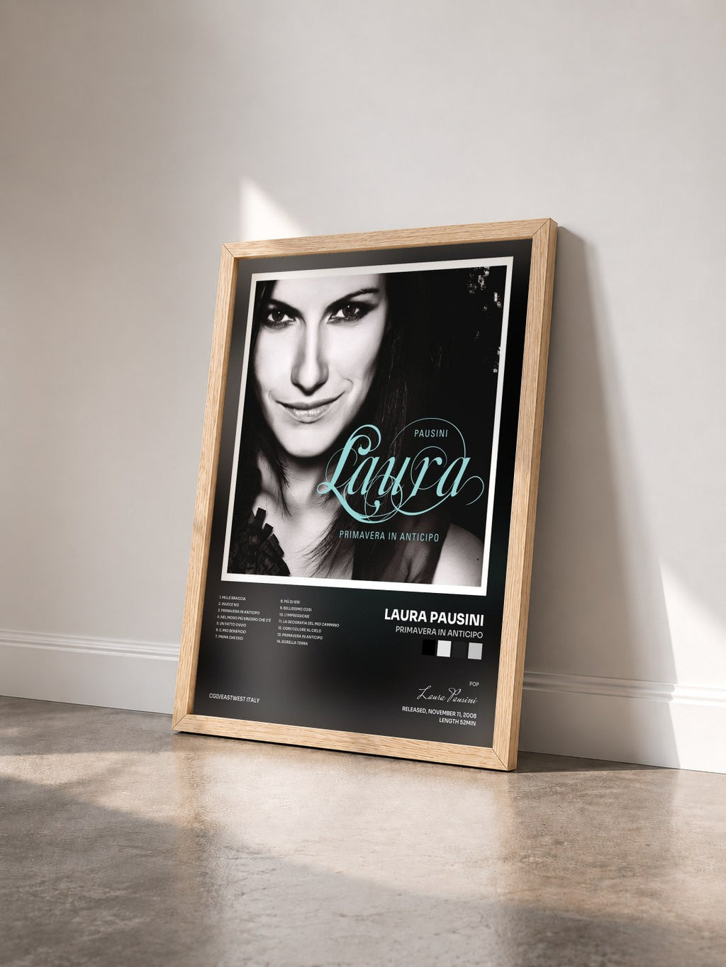 #bois Tableau de l'album Primavera in anticipo de Laura Pausini vu de trois quarts, cadre en bois brut