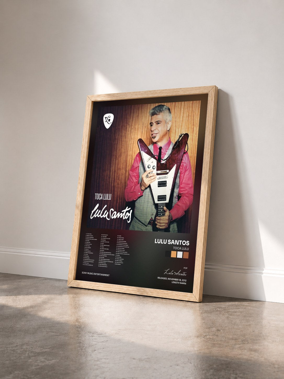 #bois Tableau de l'album Toca Lulu de Lulu Santos vu de trois quarts, cadre en bois brut