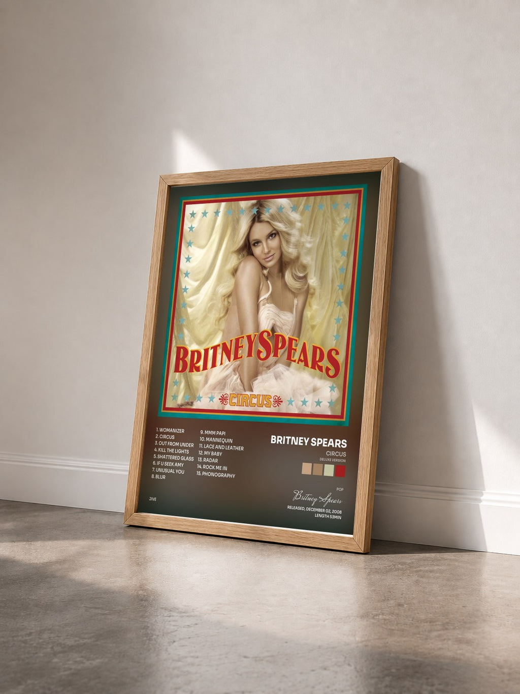 #bois Tableau de l'album Circus (Deluxe Version) de Britney Spears vu de trois quarts, cadre en bois brut