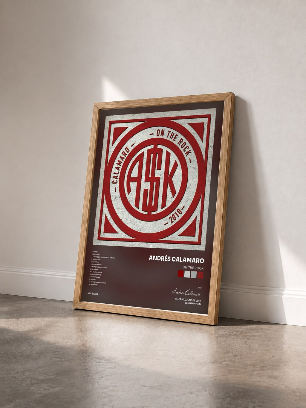 #bois Tableau de l'album On the rock de Andrés Calamaro vu de trois quarts, cadre en bois brut