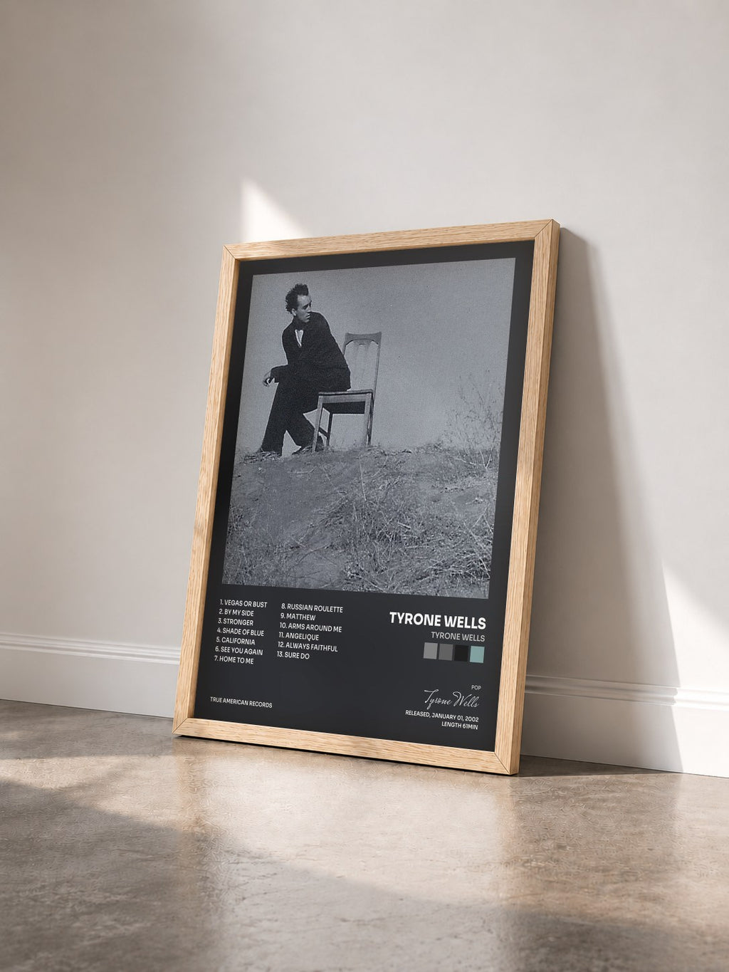 #bois Tableau de l'album Tyrone Wells de Tyrone Wells vu de trois quarts, cadre en bois brut