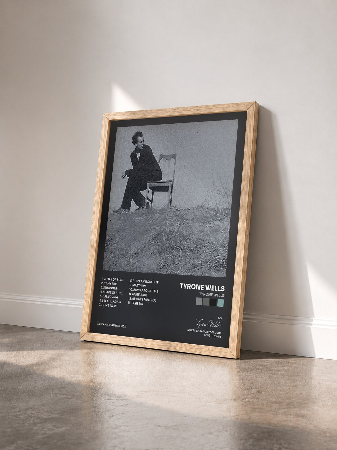 #bois Tableau de l'album Tyrone Wells de Tyrone Wells vu de trois quarts, cadre en bois brut