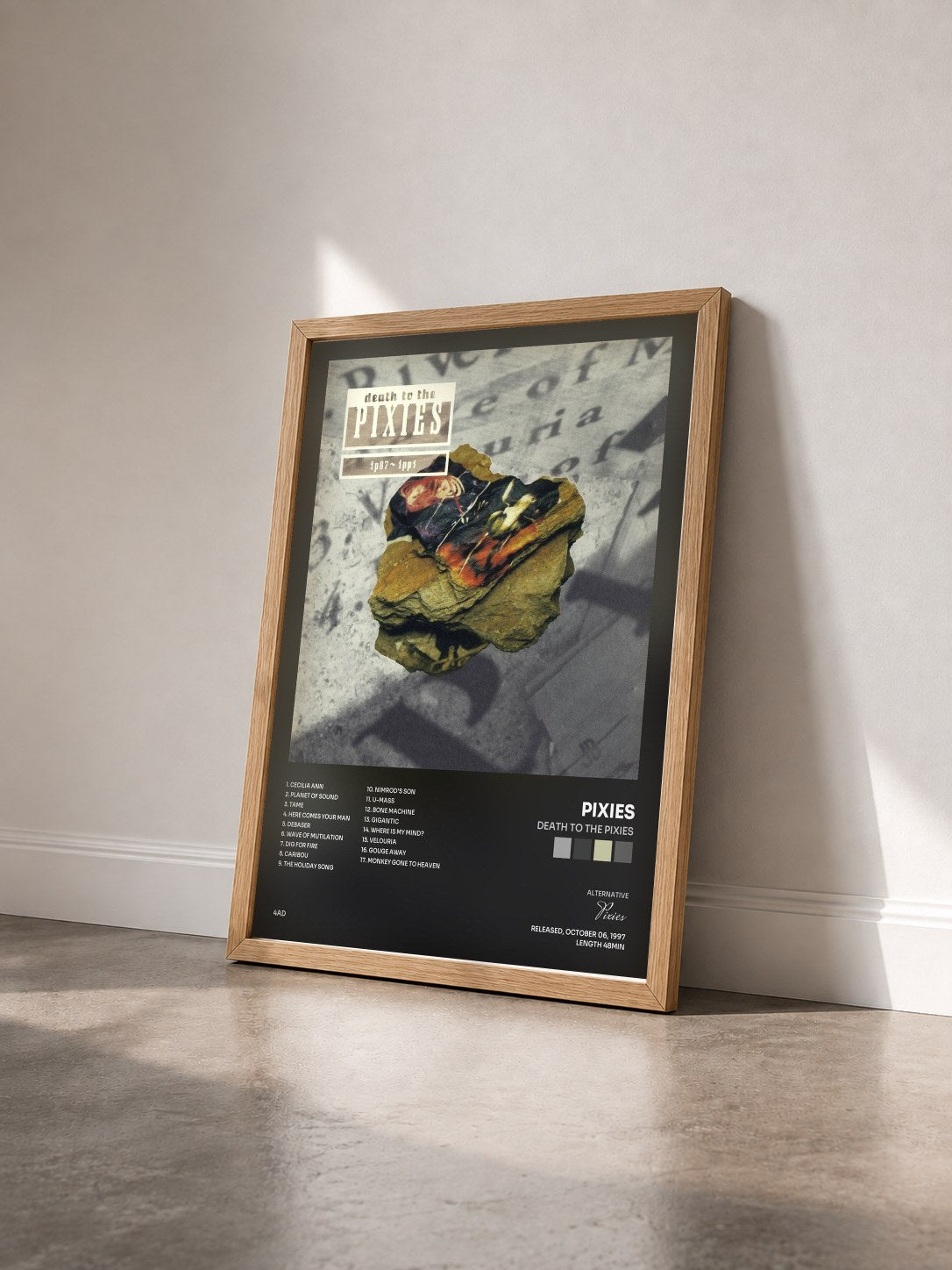 #bois Tableau de l'album Death to the Pixies de Pixies vu de trois quarts, cadre en bois brut