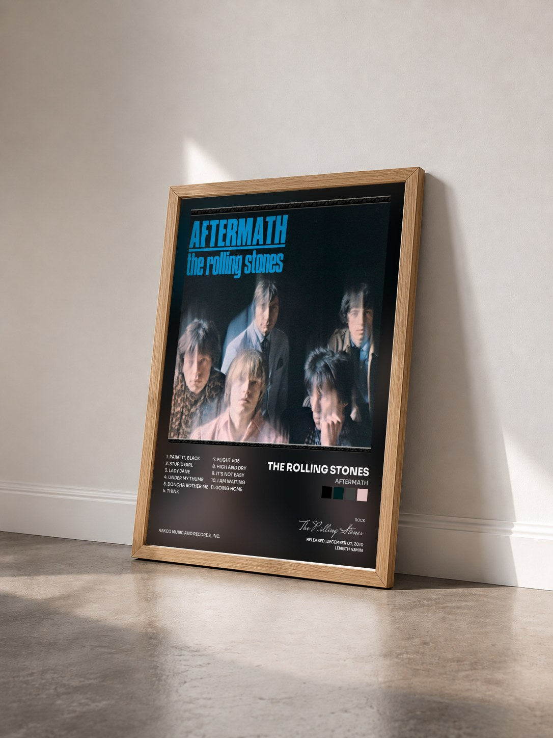 #bois Tableau de l'album Aftermath de The Rolling Stones vu de trois quarts, cadre en bois brut