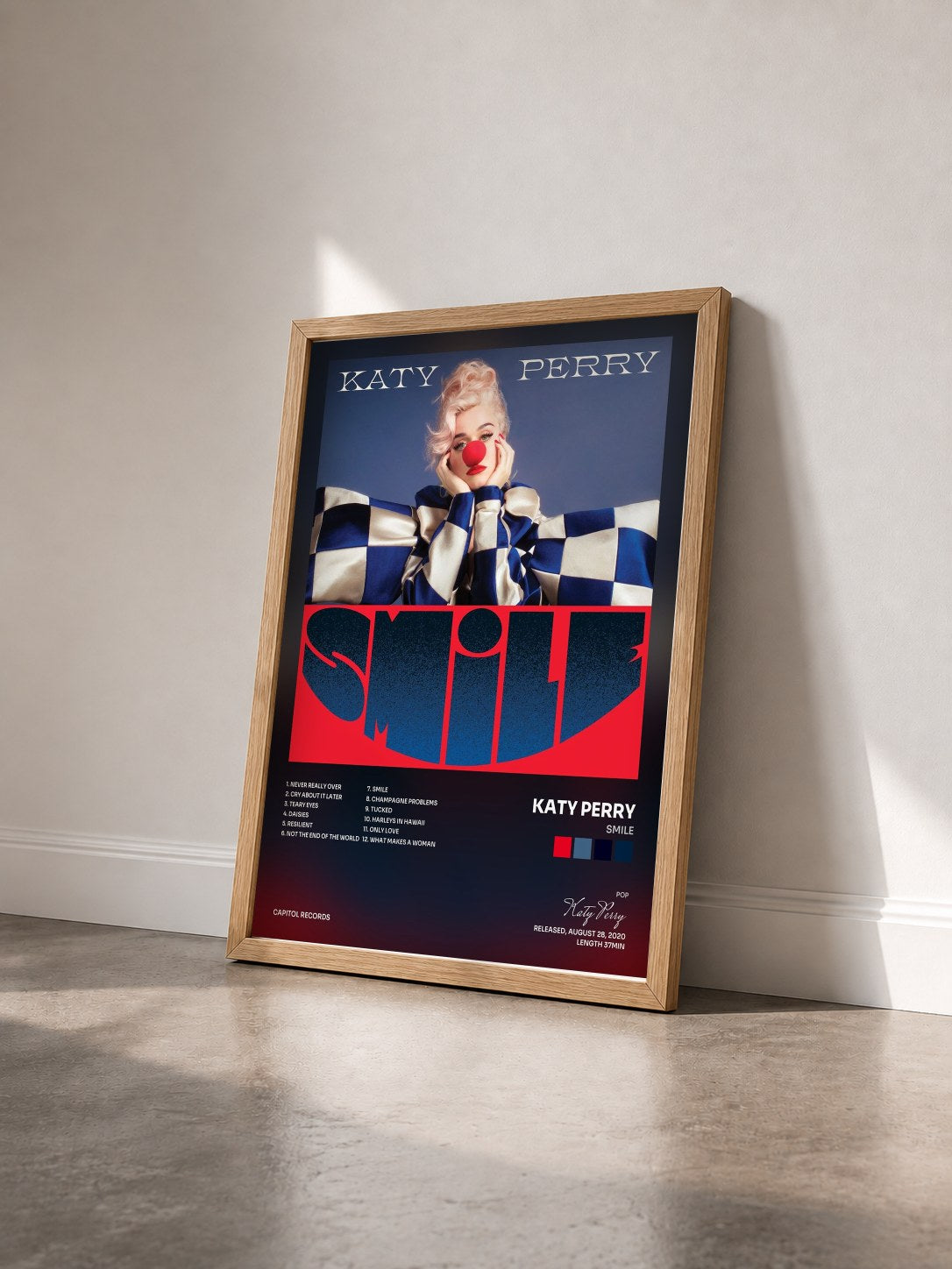 #bois Tableau de l'album Smile de Katy Perry vu de trois quarts, cadre en bois brut