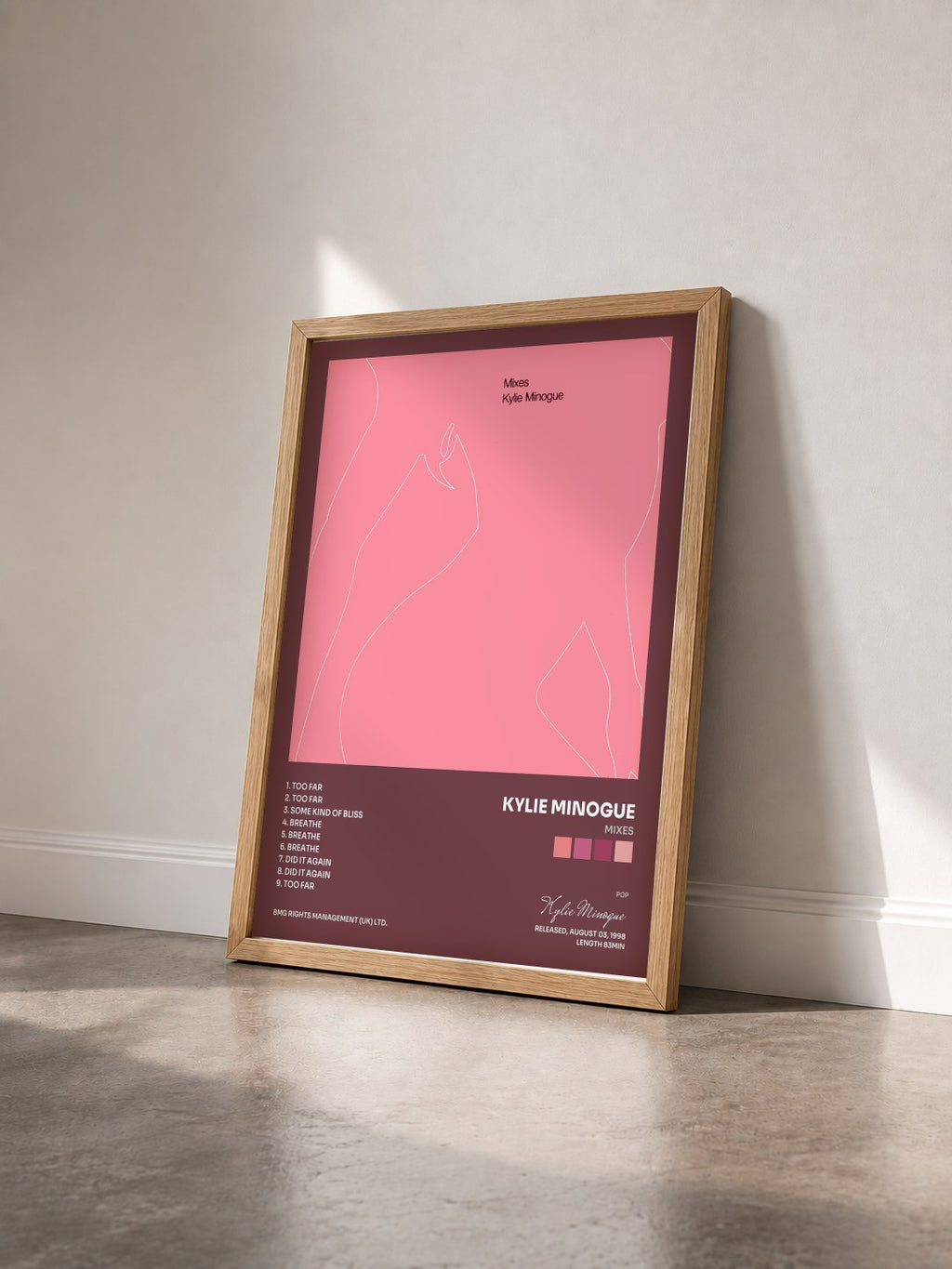 #bois Tableau de l'album Mixes de Kylie Minogue vu de trois quarts, cadre en bois brut