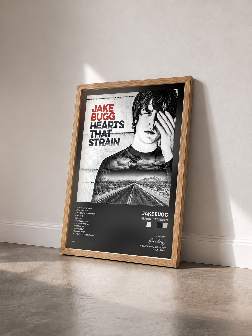 #bois Tableau de l'album Hearts That Strain de Jake Bugg vu de trois quarts, cadre en bois brut