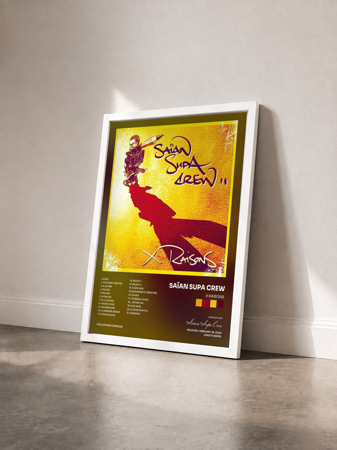 #blanc Tableau de l'album x raisons de Saïan Supa Crew vu de trois quarts, cadre blanc