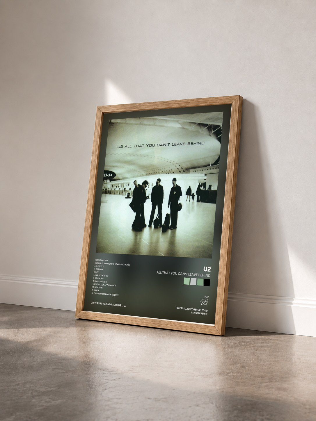 #bois Tableau de l'album All That You Can't Leave Behind de U2 vu de trois quarts, cadre en bois brut