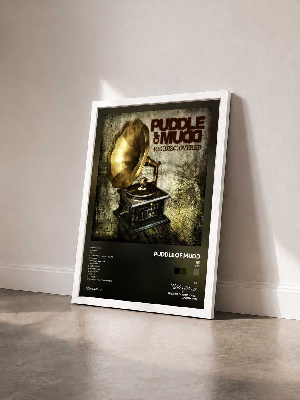 #blanc Tableau de l'album Re(Disc)overed de Puddle of Mudd vu de trois quarts, cadre blanc