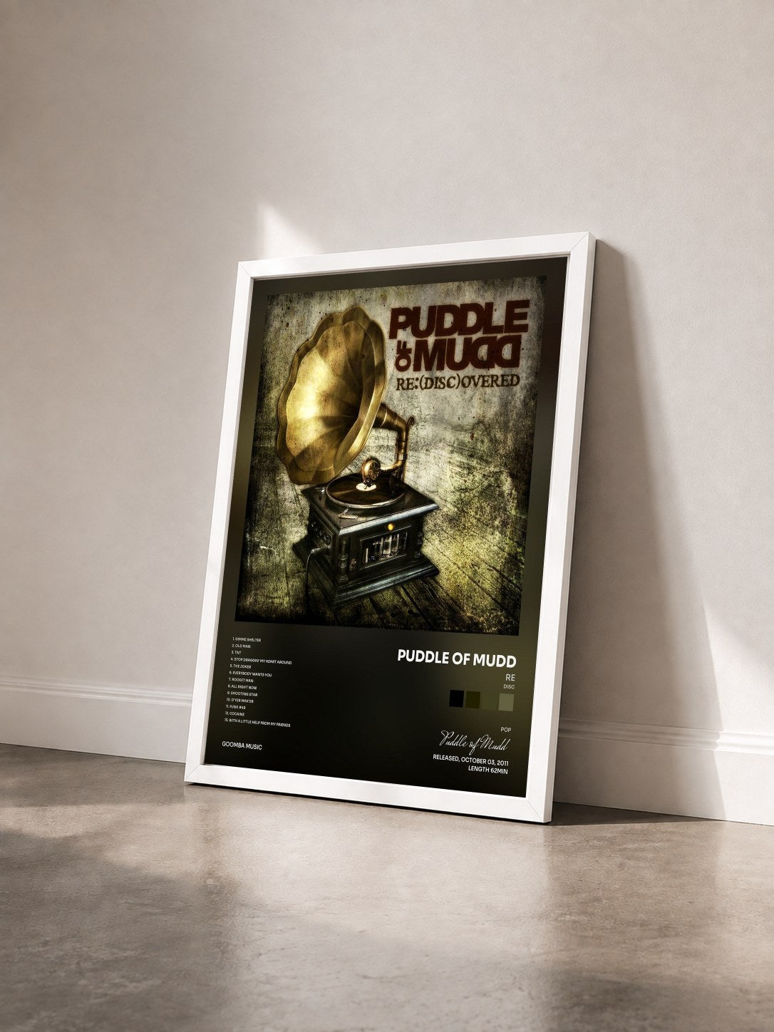 #blanc Tableau de l'album Re(Disc)overed de Puddle of Mudd vu de trois quarts, cadre blanc